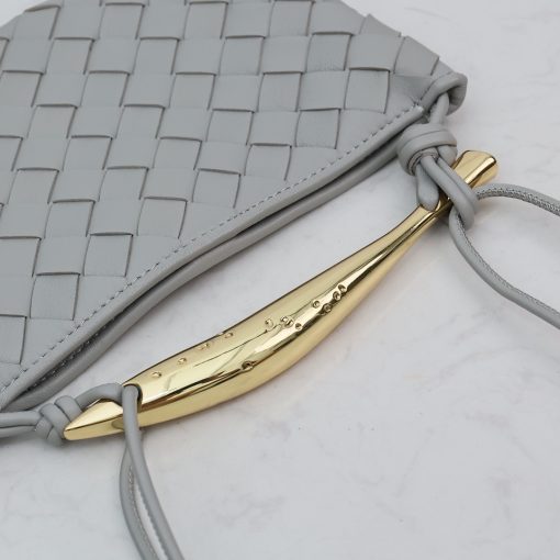 BOTTEGA VENETA Mini Sardine. Authentic quality luxury bag crafted in genuine leather comes with authenticity card, dust bag and gift bag. Crafted to Perfection, Inspired by Nature: Your Timeless Companion for All Occasions. BOTTEGA VENETA's masterful intrecciato weaving technique was originally crafted to ensure the enduring quality of leather goods. The Sardine Mini leather shoulder bag, meticulously fashioned from supple lamb leather, showcases a distinctive top handle reminiscent of a graceful fish. This versatile piece seamlessly transitions from day to night, making it the perfect, reliable companion to elegantly accommodate all your essentials.
