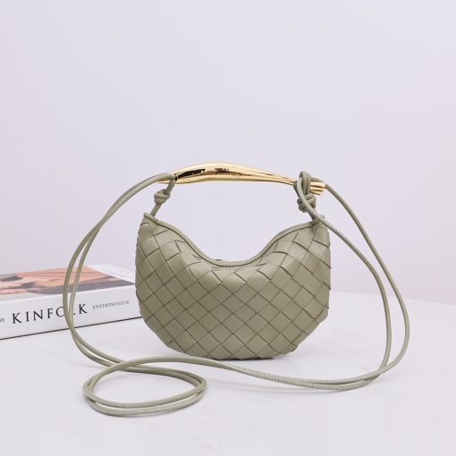 BOTTEGA VENETA Mini Sardine. Authentic quality luxury bag crafted in genuine leather comes with authenticity card, dust bag and gift bag. Crafted to Perfection, Inspired by Nature: Your Timeless Companion for All Occasions. BOTTEGA VENETA's masterful intrecciato weaving technique was originally crafted to ensure the enduring quality of leather goods. The Sardine Mini leather shoulder bag, meticulously fashioned from supple lamb leather, showcases a distinctive top handle reminiscent of a graceful fish. This versatile piece seamlessly transitions from day to night, making it the perfect, reliable companion to elegantly accommodate all your essentials.