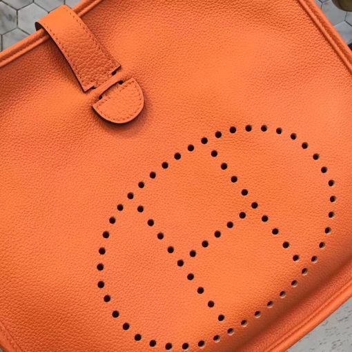 HERMÈS 'Évelyne' III 29 Shoulder Bag. Authentic quality luxury bag crafted in genuine leather comes with authenticity card, dust bag and gift bag. Unearth timeless elegance while keeping your heart close at hand. Since its inception in 1978, this bag has captivated riders with a keen sense of style. Originally designed for equestrian use, it is purposely crafted without a lining and embellished with an elegant "H" perforation. This thoughtful detail allows the wearer to carry the bag against their body, facilitating the drying process of any equipment placed inside. Boasting a shoulder strap reminiscent of a girth, the Évelyne bag truly becomes a cherished companion, always keeping one's heart close at hand.
