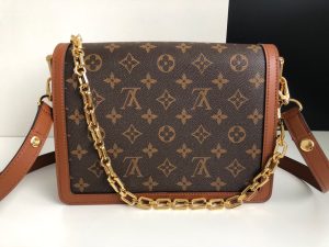 LOUIS VUITTON Dauphine MM Shoulder Bag. Authentic quality luxury bag crafted in genuine leather comes with authenticity card, dust bag and gift bag. A Modern Must-Have. Nicolas Ghesquière presents a captivating addition to the Spring-Summer 2019 collection: the Dauphine Mini handbag. This charming and sleek design is exquisitely crafted using Monogram and Monogram Reverse canvas, elegantly accentuated with smooth tan calfskin trim. The striking LV lock and leather smart strap bring a contemporary touch to this iconic piece, perfectly sized for seamless transitions from day to night. - KRIS + KIKO LOUIS VUITTON Dauphine MM Shoulder Bag. Authentic quality luxury bag crafted in genuine leather comes with authenticity card, dust bag and gift bag. A Modern Must-Have. Nicolas Ghesquière presents a captivating addition to the Spring-Summer 2019 collection: the Dauphine Mini handbag. This charming and sleek design is exquisitely crafted using Monogram and Monogram Reverse canvas, elegantly accentuated with smooth tan calfskin trim. The striking LV lock and leather smart strap bring a contemporary touch to this iconic piece, perfectly sized for seamless transitions from day to night.