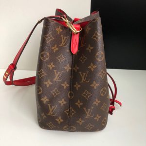 LOUIS VUITTON 'NéoNoé' Bucket Bag. Authentic quality luxury bag crafted in genuine leather comes with authenticity card, dust bag and gift bag. Effortlessly carrying the legacy of elegance and style. Originally created in 1932 for the sole purpose of carrying Champagne bottles, the Noé bag makes a fashionable comeback with a modern twist. Presenting the NéoNoé, a stunning bucket bag crafted from supple Monogram canvas adorned with vibrant calf-leather accents. Additionally, it features an adjustable strap that can be extended for a trendy cross-body carrying style. - KRIS + KIKO LOUIS VUITTON 'NéoNoé' Bucket Bag. Original Quality Bag including gift box, care book, dust bag, authenticity card. Designed in 1932 to transport bottles of Champagne, the Noé returns as the NéoNoé, an on-trend bucket bag in supple Monogram canvas with colorful calf-leather accents and an adjustable strap that lengthens for a modern, cross-body carry.