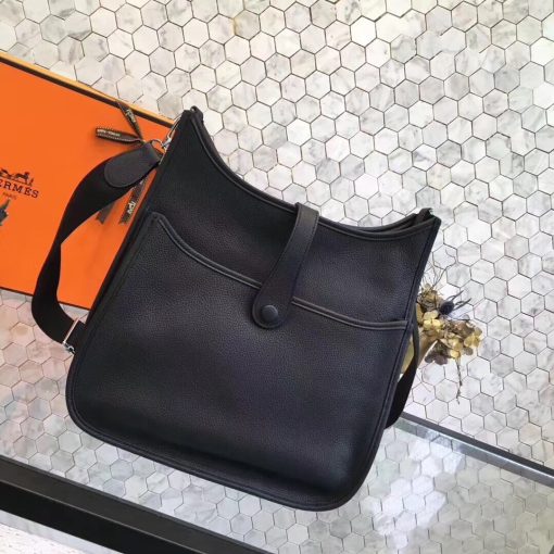 HERMÈS 'Évelyne' III 29 Shoulder Bag. Authentic quality luxury bag crafted in genuine leather comes with authenticity card, dust bag and gift bag. Unearth timeless elegance while keeping your heart close at hand. Since its inception in 1978, this bag has captivated riders with a keen sense of style. Originally designed for equestrian use, it is purposely crafted without a lining and embellished with an elegant "H" perforation. This thoughtful detail allows the wearer to carry the bag against their body, facilitating the drying process of any equipment placed inside. Boasting a shoulder strap reminiscent of a girth, the Évelyne bag truly becomes a cherished companion, always keeping one's heart close at hand.