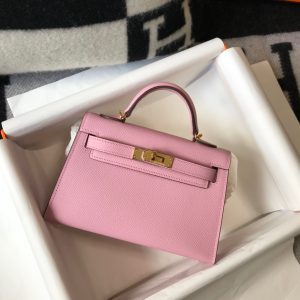 HERMÈS 'Mini Kelly’ Sellier II Leather Shoulder Bag. Authentic quality luxury bag crafted in genuine leather comes with authenticity card, dust bag and gift bag. Style meets functionality. Hermès has ingeniously crafted the ideal Kelly bag that strikes the perfect balance. Slightly larger than the sought-after baby Kelly Micro and smaller than the timeless classic Kelly, this exquisite creation effortlessly accommodates our modern gadgets, including our beloved smartphones, without compromising its charming and petite character. While it may not serve the exact purpose that earned it its name (as Grace Kelly famously concealed her baby bump with the bag in the 1950s), we wholeheartedly cherish it nonetheless. Today, embracing and showcasing our modern baby bellies is the new trend, after all. - KRIS + KIKO HERMÈS 'Mini Kelly’ Sellier II Leather Shoulder Bag. Original Quality Bag. Metal toned Hardware. HERMÈS Sales Box and Dust Bag. Booklet, Authenticity Card, Payment Slip. Lock, keys, clochette. Hermès has created the perfect Kelly. Just a little bigger than the covetable baby Kelly Micro and smaller than the beautifully classic Kelly, it's been made to fit all our modern contraptions—smart phones included—while maintaining its petite insouciance. It may not be able to be utilized the same way it got its name (Grace Kelly famously held the bag over her body in photos to conceal her baby bump in the 1950s), but we love it just the same. Modern baby bellies are for flaunting, anyway.