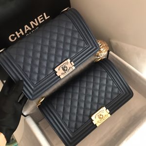 CHANEL Chevron Quilted Leather Flap Bag. Authentic quality luxury bag crafted in genuine leather comes with authenticity card, dust bag and gift bag. A love story in every stitch. The Chanel Boy Flap Bag Quilted is an exquisite creation by the renowned Karl Lagerfeld, paying homage to Gabrielle Chanel's beloved Boy Capel. This iconic design truly represents every woman's ultimate aspiration. Meticulously crafted from high-quality calfskin leather, this bag showcases Chanel's distinctive chevron quilting, complemented by a striking chunky chain link strap adorned with a leather shoulder pad and elegant metal-tone hardware accents. Opening with a captivating CC Boy logo closure, its fabric-lined interior includes a convenient slip pocket, ideal for organizing daily essentials. With its undeniable allure, this sought-after accessory is a luxurious must-have. - KRIS + KIKO CHANEL Chevron Quilted Leather Flap Bag. Authentic quality luxury bag crafted in genuine leather comes with authenticity card, dust bag and gift bag. A love story in every stitch. The Chanel Boy Flap Bag Quilted is an exquisite creation by the renowned Karl Lagerfeld, paying homage to Gabrielle Chanel's beloved Boy Capel. This iconic design truly represents every woman's ultimate aspiration. Meticulously crafted from high-quality calfskin leather, this bag showcases Chanel's distinctive chevron quilting, complemented by a striking chunky chain link strap adorned with a leather shoulder pad and elegant metal-tone hardware accents. Opening with a captivating CC Boy logo closure, its fabric-lined interior includes a convenient slip pocket, ideal for organizing daily essentials. With its undeniable allure, this sought-after accessory is a luxurious must-have.