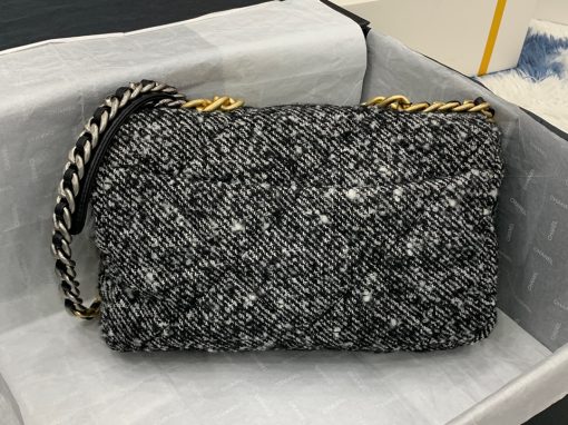 CHANEL 19 Flap Bag. Authentic quality luxury bag crafted in genuine leather comes with authenticity card, dust bag and gift bag. Effortlessly timeless, delightfully on-trend. For an everlasting touch of Parisian elegance, investing in a Chanel flap bag is the ultimate choice. However, if you're looking for a bag that seamlessly blends timeless appeal with current trends, then the Chanel 19 Flap Bag is the absolute pinnacle and arguably the most coveted bag in the world right now. Crafted with meticulous attention to detail using exquisite Tweed Fibres and adorned with the iconic two-toned Chanel 19 hardware in both Gold and Ruthenium, this icon is undeniably a striking fashion statement. The interwoven chain gracefully drapes over your shoulder or can be doubled up on your arm, exuding a sophisticated charm. Under the visionary craftsmanship of Karl Lagerfeld, Chanel stays true to its heritage by introducing classic quilted bags with a contemporary edge. Versatility is the name of the game as this exquisite piece effortlessly complements any ensemble you can imagine.