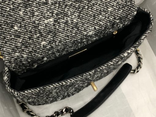 CHANEL 19 Flap Bag. Authentic quality luxury bag crafted in genuine leather comes with authenticity card, dust bag and gift bag. Effortlessly timeless, delightfully on-trend. For an everlasting touch of Parisian elegance, investing in a Chanel flap bag is the ultimate choice. However, if you're looking for a bag that seamlessly blends timeless appeal with current trends, then the Chanel 19 Flap Bag is the absolute pinnacle and arguably the most coveted bag in the world right now. Crafted with meticulous attention to detail using exquisite Tweed Fibres and adorned with the iconic two-toned Chanel 19 hardware in both Gold and Ruthenium, this icon is undeniably a striking fashion statement. The interwoven chain gracefully drapes over your shoulder or can be doubled up on your arm, exuding a sophisticated charm. Under the visionary craftsmanship of Karl Lagerfeld, Chanel stays true to its heritage by introducing classic quilted bags with a contemporary edge. Versatility is the name of the game as this exquisite piece effortlessly complements any ensemble you can imagine. 