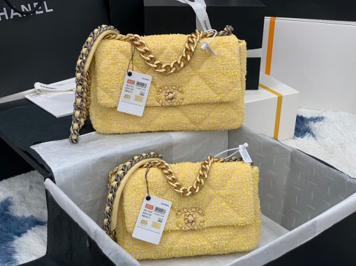 CHANEL 19 Flap Bag. Authentic quality luxury bag crafted in genuine leather comes with authenticity card, dust bag and gift bag. Effortlessly timeless, delightfully on-trend. For an everlasting touch of Parisian elegance, investing in a Chanel flap bag is the ultimate choice. However, if you're looking for a bag that seamlessly blends timeless appeal with current trends, then the Chanel 19 Flap Bag is the absolute pinnacle and arguably the most coveted bag in the world right now. Crafted with meticulous attention to detail using exquisite Tweed Fibres and adorned with the iconic two-toned Chanel 19 hardware in both Gold and Ruthenium, this icon is undeniably a striking fashion statement. The interwoven chain gracefully drapes over your shoulder or can be doubled up on your arm, exuding a sophisticated charm. Under the visionary craftsmanship of Karl Lagerfeld, Chanel stays true to its heritage by introducing classic quilted bags with a contemporary edge. Versatility is the name of the game as this exquisite piece effortlessly complements any ensemble you can imagine.