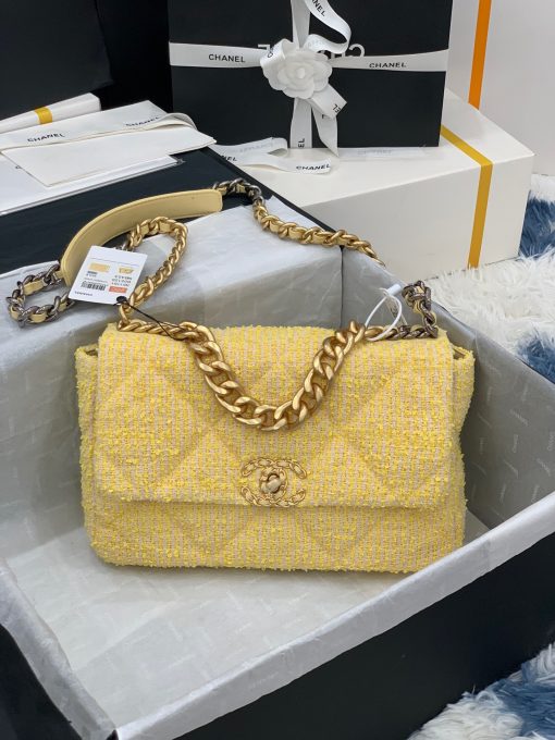 CHANEL 19 Flap Bag. Authentic quality luxury bag crafted in genuine leather comes with authenticity card, dust bag and gift bag. Effortlessly timeless, delightfully on-trend. For an everlasting touch of Parisian elegance, investing in a Chanel flap bag is the ultimate choice. However, if you're looking for a bag that seamlessly blends timeless appeal with current trends, then the Chanel 19 Flap Bag is the absolute pinnacle and arguably the most coveted bag in the world right now. Crafted with meticulous attention to detail using exquisite Tweed Fibres and adorned with the iconic two-toned Chanel 19 hardware in both Gold and Ruthenium, this icon is undeniably a striking fashion statement. The interwoven chain gracefully drapes over your shoulder or can be doubled up on your arm, exuding a sophisticated charm. Under the visionary craftsmanship of Karl Lagerfeld, Chanel stays true to its heritage by introducing classic quilted bags with a contemporary edge. Versatility is the name of the game as this exquisite piece effortlessly complements any ensemble you can imagine.