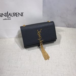 SAINT LAURENT Small 'Kate' Bag with Tassel. Authentic quality luxury bag crafted in genuine leather comes with authenticity card, dust bag and gift bag. Discover the epitome of elegance. Elegantly designed, the Monogram SAINT LAURENT bag is embellished with a sleek curb chain, interlocking YSL initials in metal, and a shimmering metallic tassel. Meticulously crafted from supple leather, the Kate shoulder bag by Saint Laurent showcases a distinctive YSL monogram plaque and a dangling tassel detail on the front, adding an exquisite touch. This exquisite accessory is ideal for a night out, serving as the perfect go-to option. It features a chain shoulder strap, a secure foldover top with magnetic closure, a spacious main compartment, an internal slip pocket, a logo patch, a logo stamp, and exquisite metal hardware for a sophisticated finish. - KRIS + KIKO SAINT LAURENT Small 'Kate' Bag with Tassel. Authentic quality luxury bag crafted in genuine leather comes with authenticity card, dust bag and gift bag. Discover the epitome of elegance. Elegantly designed, the Monogram SAINT LAURENT bag is embellished with a sleek curb chain, interlocking YSL initials in metal, and a shimmering metallic tassel. Meticulously crafted from supple leather, the Kate shoulder bag by Saint Laurent showcases a distinctive YSL monogram plaque and a dangling tassel detail on the front, adding an exquisite touch. This exquisite accessory is ideal for a night out, serving as the perfect go-to option. It features a chain shoulder strap, a secure foldover top with magnetic closure, a spacious main compartment, an internal slip pocket, a logo patch, a logo stamp, and exquisite metal hardware for a sophisticated finish.
