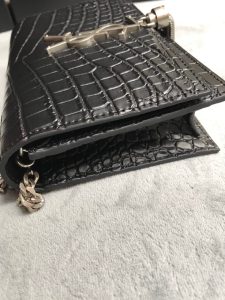 SAINT LAURENT Small 'Kate' Bag with Tassel. Authentic quality luxury bag crafted in genuine leather comes with authenticity card, dust bag and gift bag. Discover the epitome of elegance. Elegantly designed, the Monogram SAINT LAURENT bag is embellished with a sleek curb chain, interlocking YSL initials in metal, and a shimmering metallic tassel. Meticulously crafted from supple leather, the Kate shoulder bag by Saint Laurent showcases a distinctive YSL monogram plaque and a dangling tassel detail on the front, adding an exquisite touch. This exquisite accessory is ideal for a night out, serving as the perfect go-to option. It features a chain shoulder strap, a secure foldover top with magnetic closure, a spacious main compartment, an internal slip pocket, a logo patch, a logo stamp, and exquisite metal hardware for a sophisticated finish. - KRIS + KIKO SAINT LAURENT Small 'Kate' Bag with Tassel. Original Quality Bag including gift box, care book, dust bag, authenticity card. Monogram Saint Laurent bag adorned with a curb chain, interlocking YSL initials in metal, and a metallic tassel. Crafted from leather, this Kate shoulder bag from Saint Laurent is decorated with a signature YSL monogram plaque and a hanging tassel detail to the front for an extra refined touch. The perfect go-to for a night out. Featuring a chain shoulder strap, a foldover top with magnetic closure, a main internal compartment, an internal slip pocket, an internal logo patch, an internal logo stamp, and metal hardware.