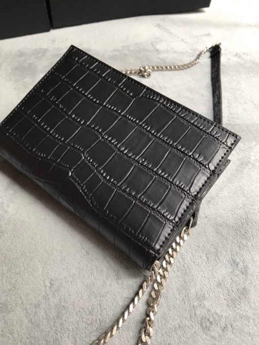 SAINT LAURENT Small 'Kate' Bag with Tassel. Authentic quality luxury bag crafted in genuine leather comes with authenticity card, dust bag and gift bag. Discover the epitome of elegance. Elegantly designed, the Monogram SAINT LAURENT bag is embellished with a sleek curb chain, interlocking YSL initials in metal, and a shimmering metallic tassel. Meticulously crafted from supple leather, the Kate shoulder bag by Saint Laurent showcases a distinctive YSL monogram plaque and a dangling tassel detail on the front, adding an exquisite touch. This exquisite accessory is ideal for a night out, serving as the perfect go-to option. It features a chain shoulder strap, a secure foldover top with magnetic closure, a spacious main compartment, an internal slip pocket, a logo patch, a logo stamp, and exquisite metal hardware for a sophisticated finish.