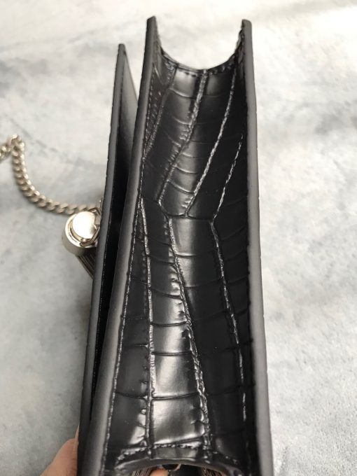 SAINT LAURENT Small 'Kate' Bag with Tassel. Authentic quality luxury bag crafted in genuine leather comes with authenticity card, dust bag and gift bag. Discover the epitome of elegance. Elegantly designed, the Monogram SAINT LAURENT bag is embellished with a sleek curb chain, interlocking YSL initials in metal, and a shimmering metallic tassel. Meticulously crafted from supple leather, the Kate shoulder bag by Saint Laurent showcases a distinctive YSL monogram plaque and a dangling tassel detail on the front, adding an exquisite touch. This exquisite accessory is ideal for a night out, serving as the perfect go-to option. It features a chain shoulder strap, a secure foldover top with magnetic closure, a spacious main compartment, an internal slip pocket, a logo patch, a logo stamp, and exquisite metal hardware for a sophisticated finish.