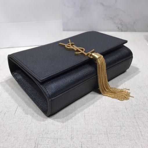 SAINT LAURENT Small 'Kate' Bag with Tassel. Authentic quality luxury bag crafted in genuine leather comes with authenticity card, dust bag and gift bag. Discover the epitome of elegance. Elegantly designed, the Monogram SAINT LAURENT bag is embellished with a sleek curb chain, interlocking YSL initials in metal, and a shimmering metallic tassel. Meticulously crafted from supple leather, the Kate shoulder bag by Saint Laurent showcases a distinctive YSL monogram plaque and a dangling tassel detail on the front, adding an exquisite touch. This exquisite accessory is ideal for a night out, serving as the perfect go-to option. It features a chain shoulder strap, a secure foldover top with magnetic closure, a spacious main compartment, an internal slip pocket, a logo patch, a logo stamp, and exquisite metal hardware for a sophisticated finish.