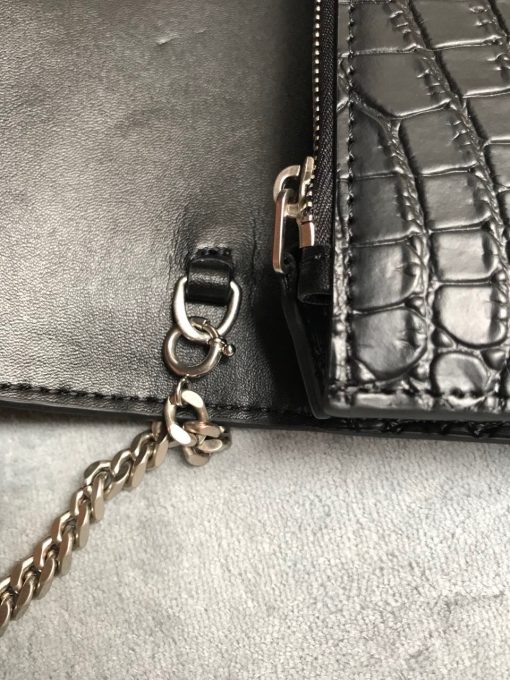 SAINT LAURENT Small 'Kate' Bag with Tassel. Authentic quality luxury bag crafted in genuine leather comes with authenticity card, dust bag and gift bag. Discover the epitome of elegance. Elegantly designed, the Monogram SAINT LAURENT bag is embellished with a sleek curb chain, interlocking YSL initials in metal, and a shimmering metallic tassel. Meticulously crafted from supple leather, the Kate shoulder bag by Saint Laurent showcases a distinctive YSL monogram plaque and a dangling tassel detail on the front, adding an exquisite touch. This exquisite accessory is ideal for a night out, serving as the perfect go-to option. It features a chain shoulder strap, a secure foldover top with magnetic closure, a spacious main compartment, an internal slip pocket, a logo patch, a logo stamp, and exquisite metal hardware for a sophisticated finish.