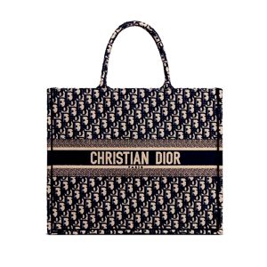 DIOR Book Tote DIOR Oblique Canvas Bag. Authentic quality luxury bag crafted in genuine leather comes with authenticity card, dust bag and gift bag. Inspired by Heritage, Designed for the Future. Inspired by a beautiful drawing created by Marc Bohan in 1967, Maria Grazia Chiuri delved into the esteemed Dior House archives to unveil the magnificent Dior Book Tote as part of the brand's exquisite Spring/Summer 2018 collection.