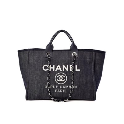 New Small CHANEL Deauville Tote. Authentic Quality Bag with literature, dust bag, gift box and authenticity card, payment slip. This is an original quality CHANEL Denim Canvas Small Deauville Tote. This lovely and best-selling tote is crafted in fine denim canvas printed with a CHANEL stitched logo. The bag features metal threaded chain shoulder straps with leather shoulder pads, canvas trim, and an open top. The bag opens to a spacious fabric interior with zipper and patch pockets. Enjoy this timeless style for everyday needs and shopping.