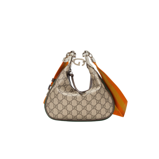 GUCCI Attache Small Shoulder Bag.  Authentic quality luxury bag crafted in genuine leather comes with authenticity card, dust bag and gift bag. Embrace timeless elegance with Gucci Love Parade - where Hollywood glamour and vintage charm unite. *ucci Love Parade pays homage to the enduring allure of Hollywood glamour by incorporating classic elements from the House's rich archives. The accessory, characterized by its elegant crescent moon shape, is adorned with a distinctive G shaped hook closure, adding to its unique charm. Crafted from luxurious materials and featuring heritage hardware, this exquisite design exudes a refined and timeless aesthetic, reminiscent of vintage beauty.