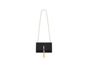 SAINT LAURENT Small 'Kate' Bag with Tassel. Original Quality Bag including gift box, care book, dust bag, authenticity card. Monogram Saint Laurent bag adorned with a curb chain, interlocking YSL initials in metal, and a metallic tassel. Crafted from leather, this Kate shoulder bag from Saint Laurent is decorated with a signature YSL monogram plaque and a hanging tassel detail to the front for an extra refined touch. The perfect go-to for a night out. Featuring a chain shoulder strap, a foldover top with magnetic closure, a main internal compartment, an internal slip pocket, an internal logo patch, an internal logo stamp, and metal hardware.