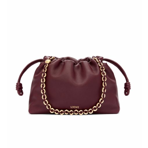 LOEWE Medium Flamenco Purse. Authentic quality luxury bag crafted in genuine leather comes with authenticity card, dust bag and gift bag. Elegant Sophistication. Meet the Flamenco Purse – where timeless style meets modern elegance. Defined by its beautifully ruched design and signature side knots, this medium-sized bag is crafted from soft, supple nappa lambskin. It's the perfect blend of luxurious texture and sophisticated detailing, making it an essential accessory for any wardrobe.