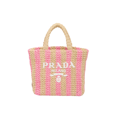 PRADA Small Crochet Tote Bag. Authentic quality luxury bag comes with authenticity card, dust bag and gift bag. Elevate Your Look with an Exquisite Tote Bag! This exquisite tote bag has a deconstructed design made of a light, natural material with a summery mood, raffia-effect yarn. Embroidered lettering logo decorates the front, and the emblematic triangle in enameled metal is the perfect finishing touch to the side.