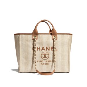 CHANEL Large Deauville Shopping Bag 2021. Authentic quality luxury bag crafted in genuine leather comes with authenticity card, dust bag and gift bag. Classic Elegance Meets Enduring Style. The CHANEL Deauville tote has evolved into an iconic CHANEL bag, gaining recognition as a popular choice. It frequently makes appearances in seasonal collections, showcasing surprising hues and materials. Interestingly, on the CHANEL website, it is referred to as the Shopping Bag; however, if you visit a CHANEL boutique and inquire about the Deauville, you will be guided to this exquisite tote bag. - KRIS + KIKO CHANEL Large Deauville Shopping Bag 2021. Authentic quality bag including gift box, booklet, dust bag, authenticity card. The CHANEL Deauville tote matured to a signature CHANEL bag. The bestseller Deauville often appears in seasonal launches in unexpected colors and materials. On the CHANEL website, Chanel calls it the Shopping Bag, but if you walk into a CHANEL boutique and ask for the Deauville, you will be directed to this tote bag.
