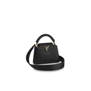 LOUIS VUITTON Capucines Mini. Authentic quality luxury bag crafted in genuine leather comes with authenticity card, dust bag and gift bag. Captivatingly vibrant. Effortlessly sophisticated. Crafted from vibrant Taurillon leather, the Capucines Mini handbag exudes an exquisite charm. Its striking color palette is tastefully enhanced by the understated metal handle rings. Just like every Capucines, this MLOUIS VUITTON Capucines Mini. Authentic quality luxury bag crafted in genuine leather comes with authenticity card, dust bag and gift bag. Captivatingly vibrant. Effortlessly sophisticated. Crafted from vibrant Taurillon leather, the Capucines Mini handbag exudes an exquisite charm. Its striking color palette is tastefully enhanced by the understated metal handle rings. Just like every Capucines, this Mini version can be effortlessly carried with the flap out, adding an air of effortless elegance, or tucked inside to showcase the iconic LV Initials. - KRIS + KIKO LOUIS VUITTON Capucines Mini. Authentic quality luxury bag crafted in genuine leather comes with authenticity card, dust bag and gift bag. Captivatingly vibrant. Effortlessly sophisticated. Crafted from vibrant Taurillon leather, the Capucines Mini handbag exudes an exquisite charm. Its striking color palette is tastefully enhanced by the understated metal handle rings. Just like every Capucines, this Mini version can be effortlessly carried with the flap out, adding an air of effortless elegance, or tucked inside to showcase the iconic LV Initials.