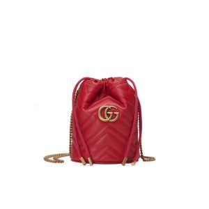 GUCCI GG Marmont Mini Bucket Bag. Authentic quality luxury bag crafted in genuine leather comes with authenticity card, dust bag and gift bag. Unleash the Vibrant Charm of Timeless Elegance. Introducing the latest addition to the GG Marmont collection: the mini bucket bag in stunning vibrant tones, meticulously crafted from Matelassé leather. This exquisite piece draws inspiration from a timeless '70s design, symbolizing the essence of the House. The iconic Double G emblem adorns the front of this accessory, further elevating its allure. With its convenient chain strap and elegant drawstring closure, this versatile bag effortlessly transitions from a shoulder bag to a crossbody one. Experience the epitome of style and functionality with this remarkable creation. - KRIS + KIKO Cris and Coco. High Quality Bags and Luxury Accessories