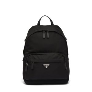 PRADA Black Logo Plaque Nylon and Saffiano Leather Backpack. Authentic quality luxury bag crafted in genuine leather comes with authenticity card, dust bag and gift bag. Practicality meets style, and carrying everything becomes effortlessly chic. Practicality is of utmost importance, while style is also highly valued. This backpack from Prada beautifully combines both aspects, featuring intricate details such as the brand's iconic enameled triangle logo plaque on the front that adds an extra touch of sophistication. It is the ideal choice for those occasions when you need to carry all your essentials and more. Truly the best of both worlds. - KRIS + KIKO PRADA Black Logo Plaque Nylon and Saffiano Leather Backpack. Original Quality Bag including gift box, literature, dust bag, authenticity card. Practicality is key but style is always appreciated, too. Detailed with the brand's signature enameled triangle logo plaque to the front for an extra refined touch, this backpack from Prada is the perfect go-to for whenever you need to carry everything but the kitchen sink. Best of both worlds.