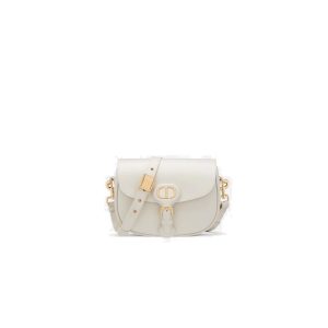 DIOR Small Bobby Bag. Authentic quality luxury bag crafted in genuine leather comes with authenticity card, dust bag and gift bag. Functionality Meets Elegance in Perfect Harmony. Maria Grazia Chiuri has introduced a new addition to the prestigious French fashion house's collection of iconic bags: the Dior Bobby. This stylish bag pays tribute to the owner's beloved pet pooch and showcases a new silhouette that resembles the D-fence bag, featuring the timeless CD logo. The Dior Bobby is the epitome of functionality and elegance, providing the perfect size for fashionable individuals who want to make a statement. With its practical shoulder strap, this sassy bag is perfectly suited to meet the demands of modern life. Its feminine curves and discreet "30 Montaigne" inscription on the back serve as a gentle nod to the renowned symbolic bag that shares its name. - KRIS + KIKO DIOR Small Bobby Bag. Original Quality Bag, including gift box, literature, dust bag, authenticity card. Maria Grazia Chiuri introduced a new silhouette to the French fashion house’s repertoire of It bags: the Dior Bobby which pays homage to the lovely pooch of the master himself. The Dior Bobby is a rounded flap that is similar to the D-fence bag with the classic CD logo. Got to admit, Bobby offers the best size for a bag that’s meant to be functional, easy to strut around in while looking like a million bucks. The Dior Bobby is a sassy shoulder bag that’s well suited for today’s call for practicality. Its feminine curve and the ‘30 Montaigne’ address on the back, renders a subtle echo of the eponymous symbolic bag.