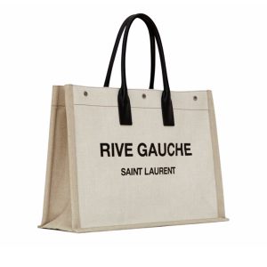 SAINT LAURENT Shopper Leather-Trimmed Printed Canvas Tote. Authentic quality luxury bag crafted in genuine leather comes with authenticity card, dust bag and gift bag. Effortlessly Chic for Errands and Market Trips. The 'Shopper' tote by SAINT LAURENT is the perfect companion for your everyday tasks or weekend excursions to the market. Crafted from sturdy canvas, it boasts elegant leather top handles that beautifully complement the 'Rive Gauche' lettering, a nod to the brand's original name in the 1960s. Inside, you'll find a roomy interior with a convenient zip pocket to keep your bills and coins safe and secure. - KRIS + KIKO Cris and Coco Original Quality Designer and Luxury Accessories