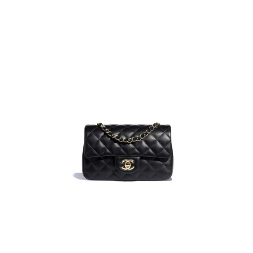 CHANEL Classic New Mini 20 cm Flap Bag. Original Quality Bag including gift box, care book, dust bag, authenticity card. This chic petite shoulder bag is crafted of luxurious shimmery lambskin leather. The crossbody bag features a long chain-link leather threaded shoulder strap and front flap with a CC turn lock. The flap opens to an interior of matching leather with zipper and patch pockets. Enjoy this fabulous bag for everyday essentials or special events with this timeless classic.