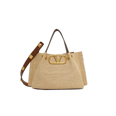 VALENTINO GARAVANI Straw Summer Small Tote.  Original Quality Bag including gift box, literature, dust bag, authenticity card. The Summer tote bag is defined by its woven raffia design and the brass-toned VLogo plaque, the unmistakable symbol of Valentino Garavani. The detachable shoulder strap is adorned with the iconic Roman Studs, another of the brand's signature details.