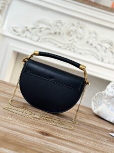 CHLOÉ Marcie Chain Flap Bag. Authentic quality luxury bag crafted in genuine leather comes with authenticity card, dust bag and gift bag. Elevating Iconic Elegance: Marcie Line Redefined. Experience a fresh take on Chloé's iconic Marcie line with this exquisite chain flap bag, meticulously crafted from a captivating blend of nappa lambskin, grained calfskin, and sumptuous suede. The line's signature hardware undergoes a graceful transformation, now adorned with Chloé's engraved jewelry hallmark, adorning the flap with sophistication. An intricately hand-braided top handle pays homage to another hallmark Marcie feature, while a gracefully extended chain strap adds a refined touch. Whether you choose to drape it over your shoulder or wear it cross-body during the day, or opt to detach the strap and carry it by hand for a sophisticated evening ensemble, this flap bag is a versatile masterpiece. Chloé's Marcie bag line effortlessly melds a feminine aesthetic with the free-spirited vibe of the '70s. An equestrian-inspired allure takes center stage, elevated by the allure of gleaming gold-toned hardware, resulting in a distinctly feminine yet timelessly chic look. - KRIS + KIKO CHLOÉ Marcie Chain Flap Bag. Authentic quality luxury bag crafted in genuine leather comes with authenticity card, dust bag and gift bag. Elevating Iconic Elegance: Marcie Line Redefined. Experience a fresh take on Chloé's iconic Marcie line with this exquisite chain flap bag, meticulously crafted from a captivating blend of nappa lambskin, grained calfskin, and sumptuous suede. The line's signature hardware undergoes a graceful transformation, now adorned with Chloé's engraved jewelry hallmark, adorning the flap with sophistication. An intricately hand-braided top handle pays homage to another hallmark Marcie feature, while a gracefully extended chain strap adds a refined touch. Whether you choose to drape it over your shoulder or wear it cross-body during the day, or opt to detach the strap and carry it by hand for a sophisticated evening ensemble, this flap bag is a versatile masterpiece. Chloé's Marcie bag line effortlessly melds a feminine aesthetic with the free-spirited vibe of the '70s. An equestrian-inspired allure takes center stage, elevated by the allure of gleaming gold-toned hardware, resulting in a distinctly feminine yet timelessly chic look.