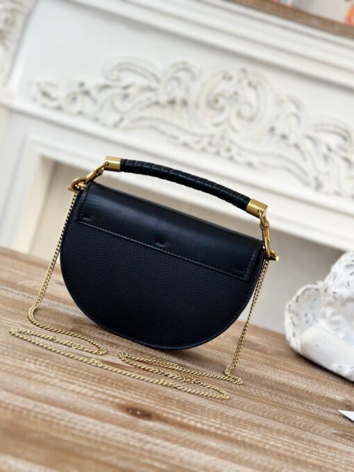 CHLOÉ Marcie Chain Flap Bag. Authentic quality luxury bag crafted in genuine leather comes with authenticity card, dust bag and gift bag. Elevating Iconic Elegance: Marcie Line Redefined. Experience a fresh take on Chloé's iconic Marcie line with this exquisite chain flap bag, meticulously crafted from a captivating blend of nappa lambskin, grained calfskin, and sumptuous suede. The line's signature hardware undergoes a graceful transformation, now adorned with Chloé's engraved jewelry hallmark, adorning the flap with sophistication. An intricately hand-braided top handle pays homage to another hallmark Marcie feature, while a gracefully extended chain strap adds a refined touch. Whether you choose to drape it over your shoulder or wear it cross-body during the day, or opt to detach the strap and carry it by hand for a sophisticated evening ensemble, this flap bag is a versatile masterpiece. Chloé's Marcie bag line effortlessly melds a feminine aesthetic with the free-spirited vibe of the '70s. An equestrian-inspired allure takes center stage, elevated by the allure of gleaming gold-toned hardware, resulting in a distinctly feminine yet timelessly chic look.
