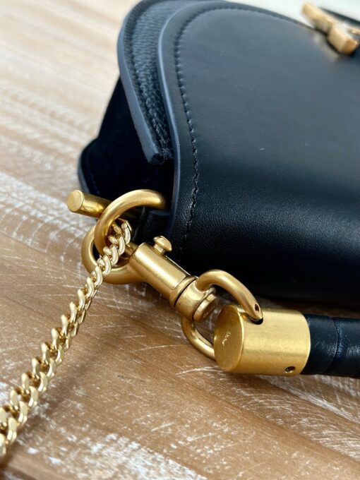 CHLOÉ Marcie Chain Flap Bag. Authentic quality luxury bag crafted in genuine leather comes with authenticity card, dust bag and gift bag. Elevating Iconic Elegance: Marcie Line Redefined. Experience a fresh take on Chloé's iconic Marcie line with this exquisite chain flap bag, meticulously crafted from a captivating blend of nappa lambskin, grained calfskin, and sumptuous suede. The line's signature hardware undergoes a graceful transformation, now adorned with Chloé's engraved jewelry hallmark, adorning the flap with sophistication. An intricately hand-braided top handle pays homage to another hallmark Marcie feature, while a gracefully extended chain strap adds a refined touch. Whether you choose to drape it over your shoulder or wear it cross-body during the day, or opt to detach the strap and carry it by hand for a sophisticated evening ensemble, this flap bag is a versatile masterpiece. Chloé's Marcie bag line effortlessly melds a feminine aesthetic with the free-spirited vibe of the '70s. An equestrian-inspired allure takes center stage, elevated by the allure of gleaming gold-toned hardware, resulting in a distinctly feminine yet timelessly chic look.