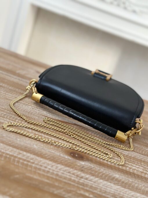 CHLOÉ Marcie Chain Flap Bag. Authentic quality luxury bag crafted in genuine leather comes with authenticity card, dust bag and gift bag. Elevating Iconic Elegance: Marcie Line Redefined. Experience a fresh take on Chloé's iconic Marcie line with this exquisite chain flap bag, meticulously crafted from a captivating blend of nappa lambskin, grained calfskin, and sumptuous suede. The line's signature hardware undergoes a graceful transformation, now adorned with Chloé's engraved jewelry hallmark, adorning the flap with sophistication. An intricately hand-braided top handle pays homage to another hallmark Marcie feature, while a gracefully extended chain strap adds a refined touch. Whether you choose to drape it over your shoulder or wear it cross-body during the day, or opt to detach the strap and carry it by hand for a sophisticated evening ensemble, this flap bag is a versatile masterpiece. Chloé's Marcie bag line effortlessly melds a feminine aesthetic with the free-spirited vibe of the '70s. An equestrian-inspired allure takes center stage, elevated by the allure of gleaming gold-toned hardware, resulting in a distinctly feminine yet timelessly chic look.