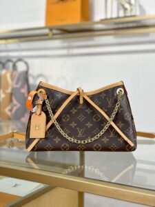 LOUIS VUITTON CarryAll BB. Authentic quality luxury bag crafted in genuine leather comes with authenticity card, dust bag and gift bag. Effortless Elegance, Day to Night – The CarryAll BB Reimagined. The iconic CarryAll BB returns this season with a stylish twist, perfect for transitioning from day to evening. Expertly crafted from the House’s signature Monogram canvas, it’s elevated with a gleaming gold-toned chain adorned with Monogram Flowers. Thoughtful details like the contrasting leather name tag and matching lace closure add a refined touch. Inside, a zipped pocket offers a convenient spot to keep your everyday essentials—like a credit card—close at hand. - KRIS + KIKO LOUIS VUITTON CarryAll BB. Authentic quality luxury bag crafted in genuine leather comes with authenticity card, dust bag and gift bag. Effortless Elegance, Day to Night – The CarryAll BB Reimagined. The iconic CarryAll BB returns this season with a stylish twist, perfect for transitioning from day to evening. Expertly crafted from the House’s signature Monogram canvas, it’s elevated with a gleaming gold-toned chain adorned with Monogram Flowers. Thoughtful details like the contrasting leather name tag and matching lace closure add a refined touch. Inside, a zipped pocket offers a convenient spot to keep your everyday essentials—like a credit card—close at hand.