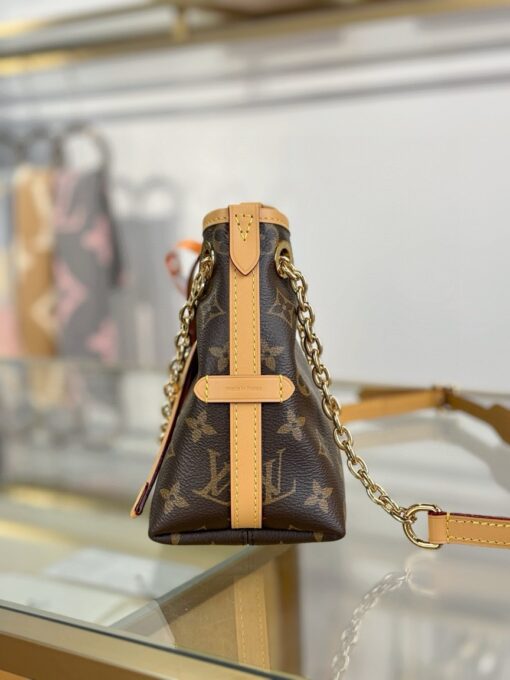 LOUIS VUITTON CarryAll BB. Authentic quality luxury bag crafted in genuine leather comes with authenticity card, dust bag and gift bag. Effortless Elegance, Day to Night – The CarryAll BB Reimagined. The iconic CarryAll BB returns this season with a stylish twist, perfect for transitioning from day to evening. Expertly crafted from the House’s signature Monogram canvas, it’s elevated with a gleaming gold-toned chain adorned with Monogram Flowers. Thoughtful details like the contrasting leather name tag and matching lace closure add a refined touch. Inside, a zipped pocket offers a convenient spot to keep your everyday essentials—like a credit card—close at hand.