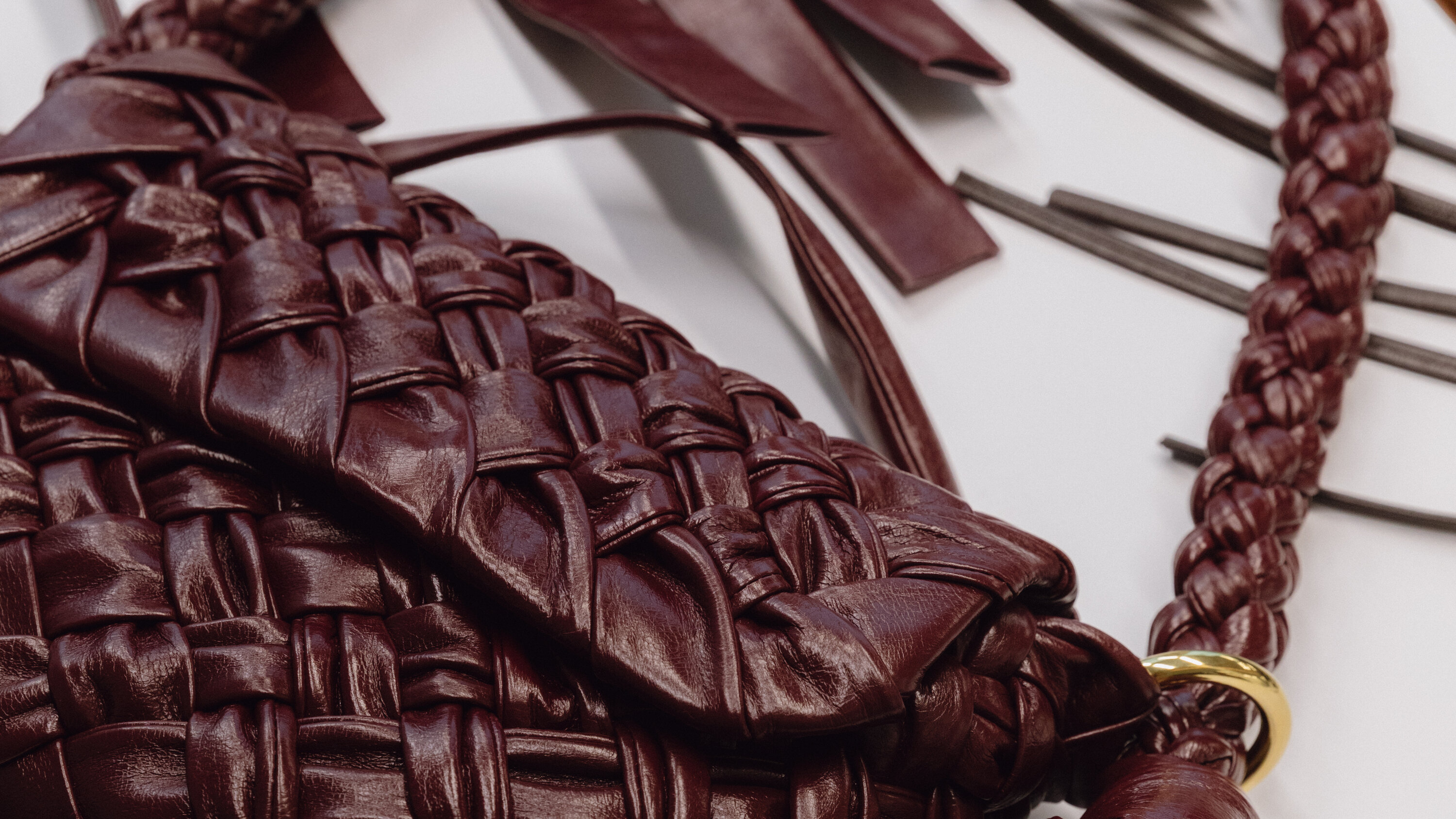A craftsman mid-stitch, transforming leather into a bag that looks like it flew first class from Paris — but didn’t. A craftsman mid-stitch, transforming leather into a bag that looks like it flew first class from Paris — but didn’t.