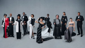 Met Gala attendees ascending the iconic steps in refined tailoring