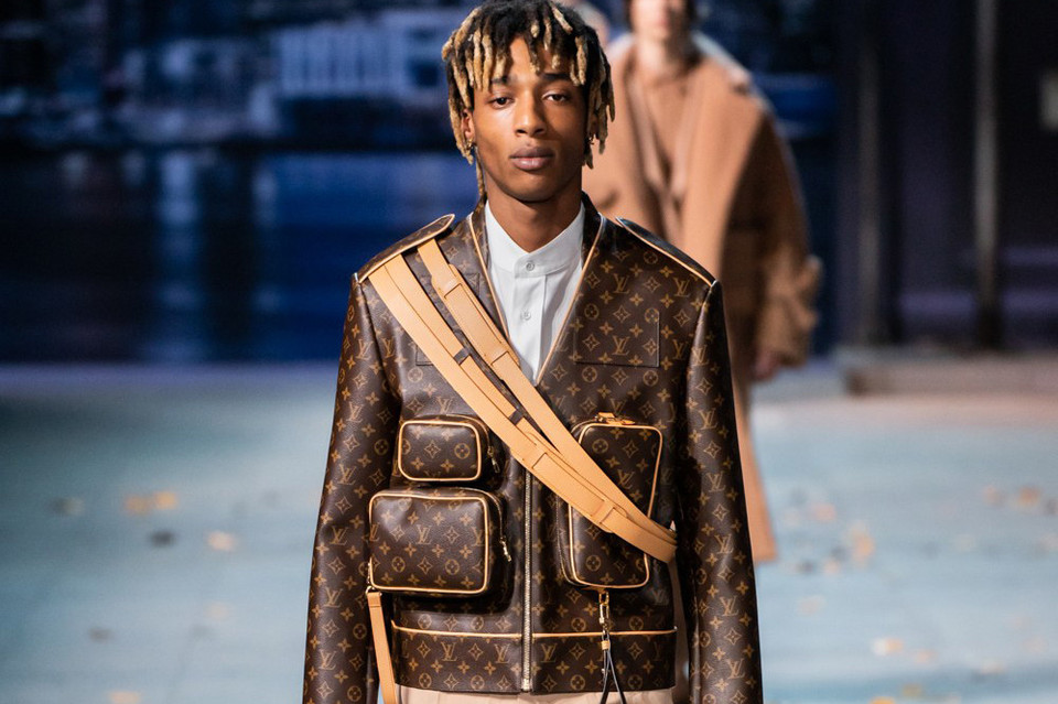Collage of luxury fashion logos torn apart by finance and corporate symbolism Collage of luxury fashion logos torn apart by finance and corporate symbolism