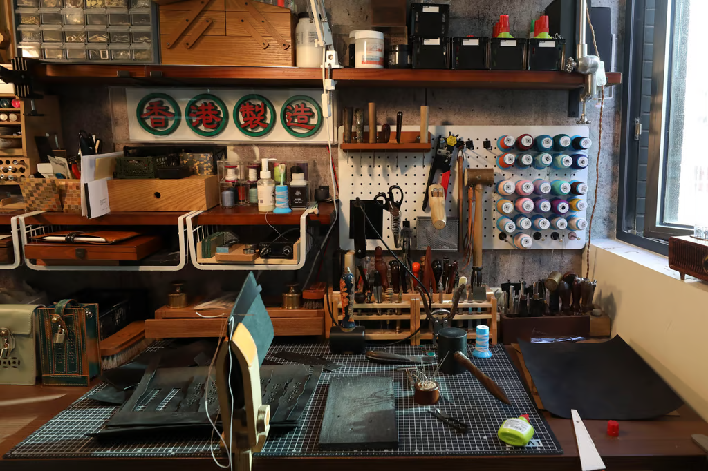 A boutique Chinese leather workshop with tools and leather goods in progress
