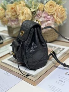 DIOR Small Caro Backpack. Authentic quality luxury bag crafted in genuine leather comes with authenticity card, dust bag and gift bag. Elegance Meets Effortless Edge. Elevate your everyday with the DIOR Small Caro Backpack — a flawless blend of modern femininity and iconic House craftsmanship. Luxuriously crafted in lambskin, its supple silhouette is enhanced by bold Macrocannage topstitching that whispers timeless Dior style. The antique gold-finish ‘CD’ clasp opens to a drawstring main compartment, perfectly balancing beauty and practicality. A discreet flap pocket keeps your daily essentials close at hand, while the top handle and adjustable leather straps offer versatile, all-day comfort. Whether slung over your shoulder or carried by hand, this petite powerhouse delivers Parisian polish in every step. - KRIS + KIKO DIOR Small Caro Backpack. Authentic quality luxury bag crafted in genuine leather comes with authenticity card, dust bag and gift bag. Elegance Meets Effortless Edge. Elevate your everyday with the DIOR Small Caro Backpack — a flawless blend of modern femininity and iconic House craftsmanship. Luxuriously crafted in lambskin, its supple silhouette is enhanced by bold Macrocannage topstitching that whispers timeless Dior style. The antique gold-finish ‘CD’ clasp opens to a drawstring main compartment, perfectly balancing beauty and practicality. A discreet flap pocket keeps your daily essentials close at hand, while the top handle and adjustable leather straps offer versatile, all-day comfort. Whether slung over your shoulder or carried by hand, this petite powerhouse delivers Parisian polish in every step.