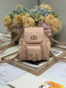 DIOR Small Caro Backpack. Authentic quality luxury bag crafted in genuine leather comes with authenticity card, dust bag and gift bag. Elegance Meets Effortless Edge. Elevate your everyday with the DIOR Small Caro Backpack — a flawless blend of modern femininity and iconic House craftsmanship. Luxuriously crafted in lambskin, its supple silhouette is enhanced by bold Macrocannage topstitching that whispers timeless Dior style. The antique gold-finish ‘CD’ clasp opens to a drawstring main compartment, perfectly balancing beauty and practicality. A discreet flap pocket keeps your daily essentials close at hand, while the top handle and adjustable leather straps offer versatile, all-day comfort. Whether slung over your shoulder or carried by hand, this petite powerhouse delivers Parisian polish in every step. - KRIS + KIKO DIOR Small Caro Backpack. Authentic quality luxury bag crafted in genuine leather comes with authenticity card, dust bag and gift bag. Elegance Meets Effortless Edge. Elevate your everyday with the DIOR Small Caro Backpack — a flawless blend of modern femininity and iconic House craftsmanship. Luxuriously crafted in lambskin, its supple silhouette is enhanced by bold Macrocannage topstitching that whispers timeless Dior style. The antique gold-finish ‘CD’ clasp opens to a drawstring main compartment, perfectly balancing beauty and practicality. A discreet flap pocket keeps your daily essentials close at hand, while the top handle and adjustable leather straps offer versatile, all-day comfort. Whether slung over your shoulder or carried by hand, this petite powerhouse delivers Parisian polish in every step.
