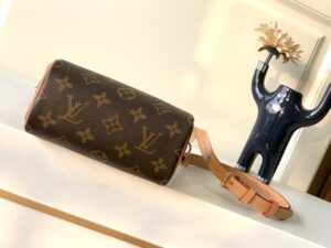 LOUIS VUITTON Speedy Nano. Authentic quality luxury bag crafted in genuine leather comes with authenticity card, dust bag and gift bag. Iconic Style, Perfectly Miniaturized. Meet the LOUIS VUITTON Speedy Nano— a petite powerhouse that captures the timeless allure of the iconic Speedy in its most charming form. Revamped in classic Monogram canvas and finished with aged natural cowhide leather, this mini marvel is made for the modern minimalist. Crafted with delicate gold-tone hardware and featuring two signature top handles, the Speedy Nano is both playful and practical. Its removable, adjustable shoulder strap adds effortless versatility—carry it by hand for polished poise or sling it crossbody for chic, on-the-go ease. Compact enough for your essentials. Iconic enough to turn heads. Small bag, big legacy! - KRIS + KIKO LOUIS VUITTON Speedy Nano. Authentic quality luxury bag crafted in genuine leather comes with authenticity card, dust bag and gift bag. Iconic Style, Perfectly Miniaturized. Meet the LOUIS VUITTON Speedy Nano— a petite powerhouse that captures the timeless allure of the iconic Speedy in its most charming form. Revamped in classic Monogram canvas and finished with aged natural cowhide leather, this mini marvel is made for the modern minimalist. Crafted with delicate gold-tone hardware and featuring two signature top handles, the Speedy Nano is both playful and practical. Its removable, adjustable shoulder strap adds effortless versatility—carry it by hand for polished poise or sling it crossbody for chic, on-the-go ease. Compact enough for your essentials. Iconic enough to turn heads. Small bag, big legacy!