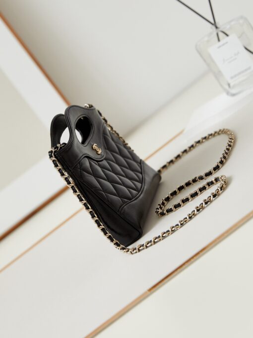 CHANEL 31 Nano Shopping Bag. Authentic quality luxury bag crafted in genuine leather comes with authenticity card, dust bag and gift bag. Small in size, grand in statement. A miniature marvel that captures the sophistication of CHANEL in its most playful form. Crafted with meticulous precision, this petite icon merges the timeless spirit of the CHANEL 31 with a modern twist on everyday elegance. Designed in supple lambskin and finished with gleaming gold-tone hardware, the Nano 31 doesn’t just carry your essentials — it carries your attitude. Whether worn crossbody, by hand, or dangling from the crook of your arm, this charming piece elevates every ensemble with a whisper of Parisian chic. Perfect for a night out or a day in the spotlight, it’s not just a bag — it’s your boldest accessory in its most compact form. Because luxury doesn't need to shout. Sometimes, it just needs to charm.