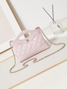 CHANEL 31 Nano Shopping Bag. Authentic quality luxury bag crafted in genuine leather comes with authenticity card, dust bag and gift bag. Small in size, grand in statement. A miniature marvel that captures the sophistication of CHANEL in its most playful form. Crafted with meticulous precision, this petite icon merges the timeless spirit of the CHANEL 31 with a modern twist on everyday elegance. Designed in supple lambskin and finished with gleaming gold-tone hardware, the Nano 31 doesn’t just carry your essentials — it carries your attitude. Whether worn crossbody, by hand, or dangling from the crook of your arm, this charming piece elevates every ensemble with a whisper of Parisian chic. Perfect for a night out or a day in the spotlight, it’s not just a bag — it’s your boldest accessory in its most compact form. Because luxury doesn't need to shout. Sometimes, it just needs to charm. - KRIS + KIKO CHANEL 31 Nano Shopping Bag. Authentic quality luxury bag crafted in genuine leather comes with authenticity card, dust bag and gift bag. Small in size, grand in statement. A miniature marvel that captures the sophistication of CHANEL in its most playful form. Crafted with meticulous precision, this petite icon merges the timeless spirit of the CHANEL 31 with a modern twist on everyday elegance. Designed in supple lambskin and finished with gleaming gold-tone hardware, the Nano 31 doesn’t just carry your essentials — it carries your attitude. Whether worn crossbody, by hand, or dangling from the crook of your arm, this charming piece elevates every ensemble with a whisper of Parisian chic. Perfect for a night out or a day in the spotlight, it’s not just a bag — it’s your boldest accessory in its most compact form. Because luxury doesn't need to shout. Sometimes, it just needs to charm.