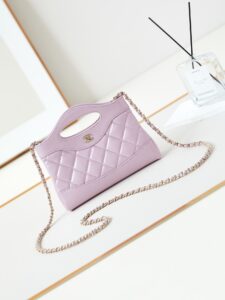 CHANEL 31 Nano Shopping Bag. Authentic quality luxury bag crafted in genuine leather comes with authenticity card, dust bag and gift bag. Small in size, grand in statement. A miniature marvel that captures the sophistication of CHANEL in its most playful form. Crafted with meticulous precision, this petite icon merges the timeless spirit of the CHANEL 31 with a modern twist on everyday elegance. Designed in supple lambskin and finished with gleaming gold-tone hardware, the Nano 31 doesn’t just carry your essentials — it carries your attitude. Whether worn crossbody, by hand, or dangling from the crook of your arm, this charming piece elevates every ensemble with a whisper of Parisian chic. Perfect for a night out or a day in the spotlight, it’s not just a bag — it’s your boldest accessory in its most compact form. Because luxury doesn't need to shout. Sometimes, it just needs to charm. - KRIS + KIKO CHANEL 31 Nano Shopping Bag. Authentic quality luxury bag crafted in genuine leather comes with authenticity card, dust bag and gift bag. Small in size, grand in statement. A miniature marvel that captures the sophistication of CHANEL in its most playful form. Crafted with meticulous precision, this petite icon merges the timeless spirit of the CHANEL 31 with a modern twist on everyday elegance. Designed in supple lambskin and finished with gleaming gold-tone hardware, the Nano 31 doesn’t just carry your essentials — it carries your attitude. Whether worn crossbody, by hand, or dangling from the crook of your arm, this charming piece elevates every ensemble with a whisper of Parisian chic. Perfect for a night out or a day in the spotlight, it’s not just a bag — it’s your boldest accessory in its most compact form. Because luxury doesn't need to shout. Sometimes, it just needs to charm.