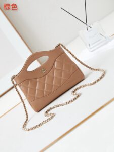 CHANEL 31 Nano Shopping Bag. Authentic quality luxury bag crafted in genuine leather comes with authenticity card, dust bag and gift bag. Small in size, grand in statement. A miniature marvel that captures the sophistication of CHANEL in its most playful form. Crafted with meticulous precision, this petite icon merges the timeless spirit of the CHANEL 31 with a modern twist on everyday elegance. Designed in supple lambskin and finished with gleaming gold-tone hardware, the Nano 31 doesn’t just carry your essentials — it carries your attitude. Whether worn crossbody, by hand, or dangling from the crook of your arm, this charming piece elevates every ensemble with a whisper of Parisian chic. Perfect for a night out or a day in the spotlight, it’s not just a bag — it’s your boldest accessory in its most compact form. Because luxury doesn't need to shout. Sometimes, it just needs to charm. - KRIS + KIKO CHANEL 31 Nano Shopping Bag. Authentic quality luxury bag crafted in genuine leather comes with authenticity card, dust bag and gift bag. Small in size, grand in statement. A miniature marvel that captures the sophistication of CHANEL in its most playful form. Crafted with meticulous precision, this petite icon merges the timeless spirit of the CHANEL 31 with a modern twist on everyday elegance. Designed in supple lambskin and finished with gleaming gold-tone hardware, the Nano 31 doesn’t just carry your essentials — it carries your attitude. Whether worn crossbody, by hand, or dangling from the crook of your arm, this charming piece elevates every ensemble with a whisper of Parisian chic. Perfect for a night out or a day in the spotlight, it’s not just a bag — it’s your boldest accessory in its most compact form. Because luxury doesn't need to shout. Sometimes, it just needs to charm.