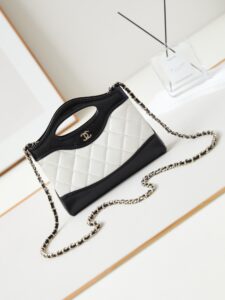 CHANEL 31 Nano Shopping Bag. Authentic quality luxury bag crafted in genuine leather comes with authenticity card, dust bag and gift bag. Small in size, grand in statement. A miniature marvel that captures the sophistication of CHANEL in its most playful form. Crafted with meticulous precision, this petite icon merges the timeless spirit of the CHANEL 31 with a modern twist on everyday elegance. Designed in supple lambskin and finished with gleaming gold-tone hardware, the Nano 31 doesn’t just carry your essentials — it carries your attitude. Whether worn crossbody, by hand, or dangling from the crook of your arm, this charming piece elevates every ensemble with a whisper of Parisian chic. Perfect for a night out or a day in the spotlight, it’s not just a bag — it’s your boldest accessory in its most compact form. Because luxury doesn't need to shout. Sometimes, it just needs to charm. - KRIS + KIKO CHANEL 31 Nano Shopping Bag. Authentic quality luxury bag crafted in genuine leather comes with authenticity card, dust bag and gift bag. Small in size, grand in statement. A miniature marvel that captures the sophistication of CHANEL in its most playful form. Crafted with meticulous precision, this petite icon merges the timeless spirit of the CHANEL 31 with a modern twist on everyday elegance. Designed in supple lambskin and finished with gleaming gold-tone hardware, the Nano 31 doesn’t just carry your essentials — it carries your attitude. Whether worn crossbody, by hand, or dangling from the crook of your arm, this charming piece elevates every ensemble with a whisper of Parisian chic. Perfect for a night out or a day in the spotlight, it’s not just a bag — it’s your boldest accessory in its most compact form. Because luxury doesn't need to shout. Sometimes, it just needs to charm.